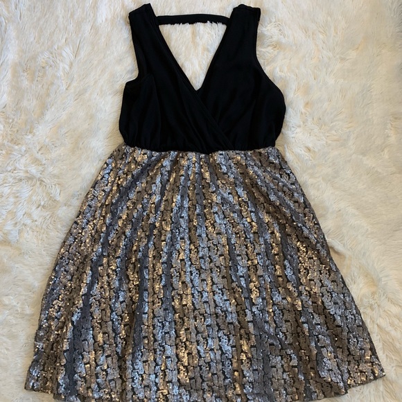 torrid Dresses & Skirts - V-Neck black with metallic dress.